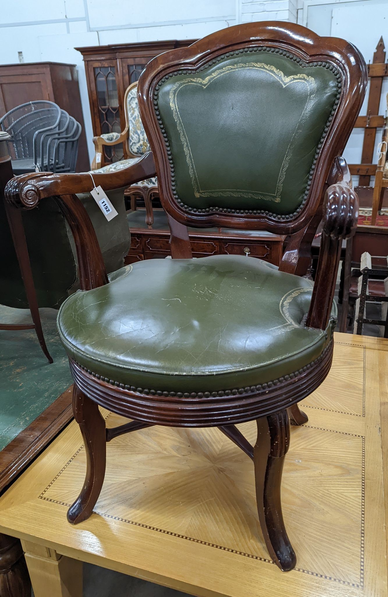 A Victorian style mahogany and green leather swivel desk chair, width 60cm, depth 50cm, height 96cm